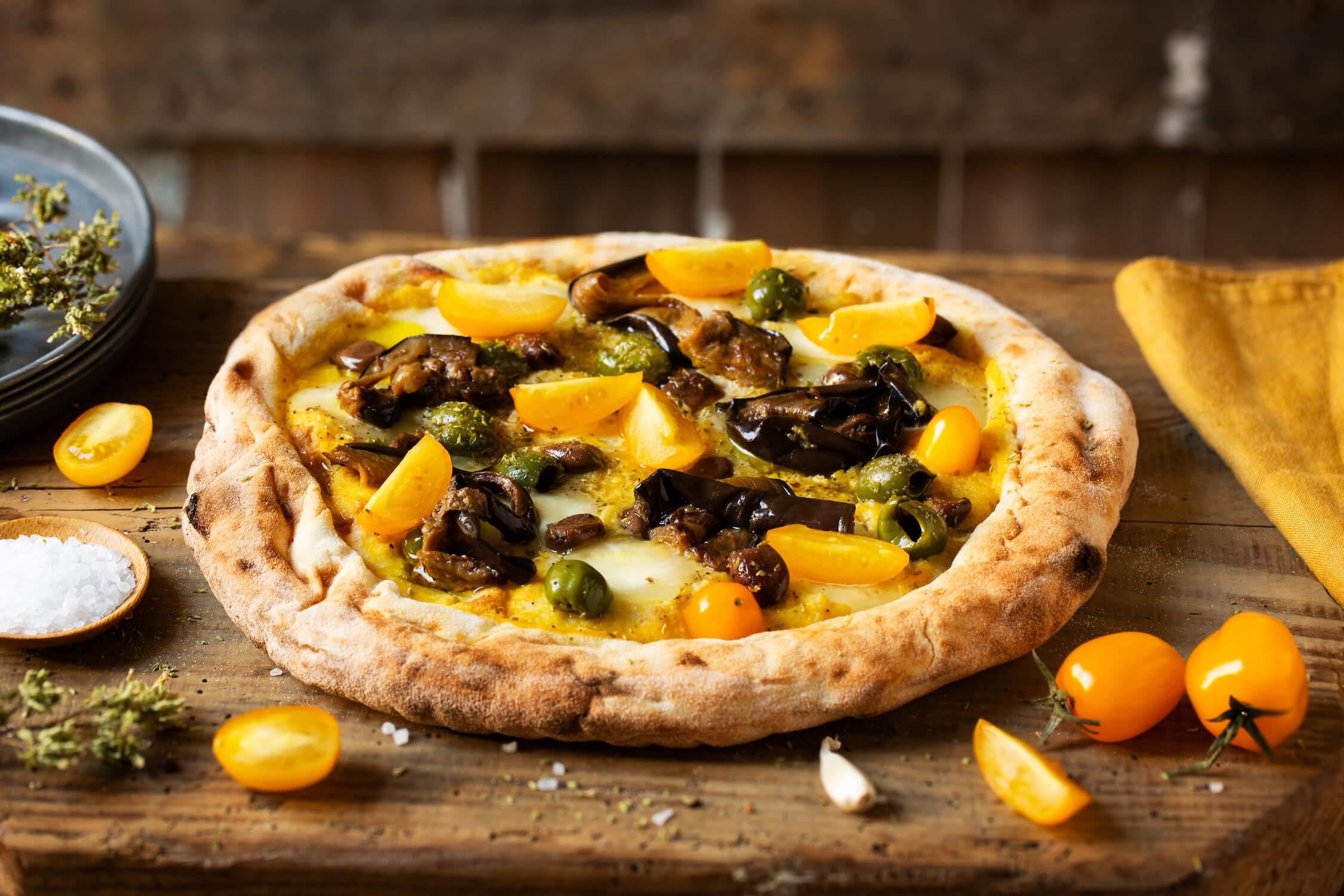PIZZA with yellow datterino tomato puree, olives, and grilled eggplant